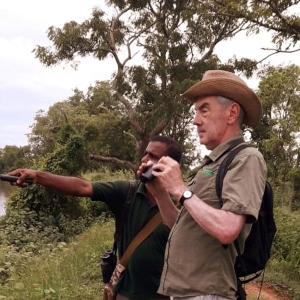 A tourist client explore the nature with their guide during the walking safari 